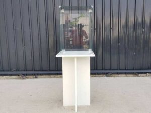White wooden display case with glass doors.
