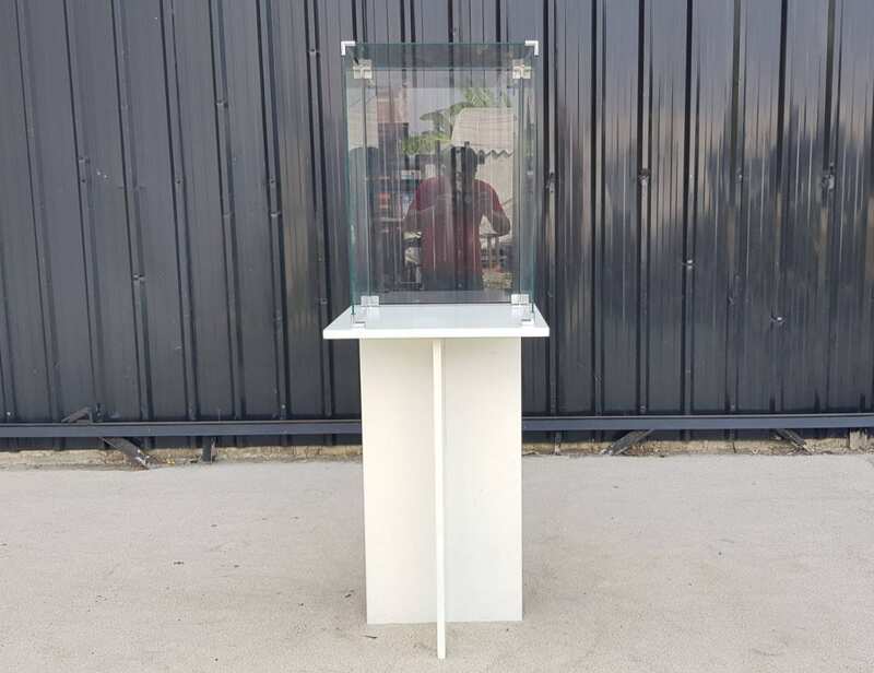 White wooden display case with glass doors.