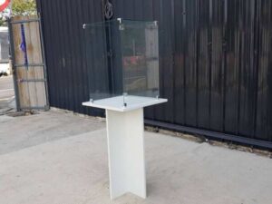 White wooden display case with glass doors.