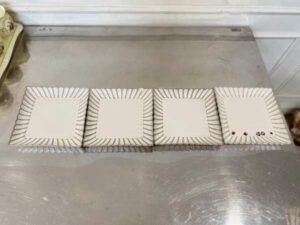 Set of white ceramic containers with striped pattern