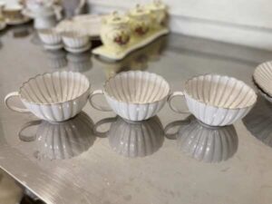 Set of white ceramic containers with striped pattern