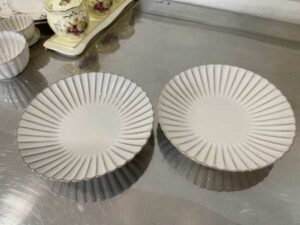 Set of white ceramic containers with striped pattern