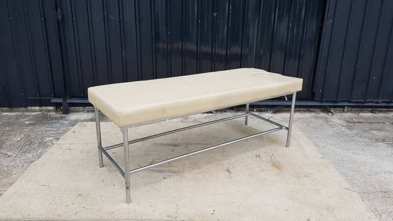 Spa massage bed with steel legs and leather cushion, cream color