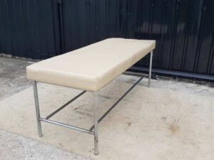 Spa massage bed with steel legs and leather cushion, cream color