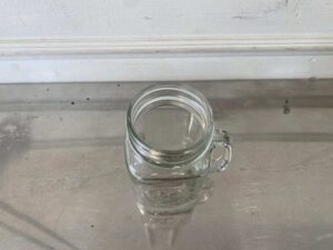 Set of clear glass Mason Jars with handles, embossed rooster design, Libbey brand.