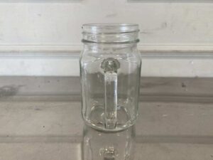 Set of clear glass Mason Jars with handles, embossed rooster design, Libbey brand.
