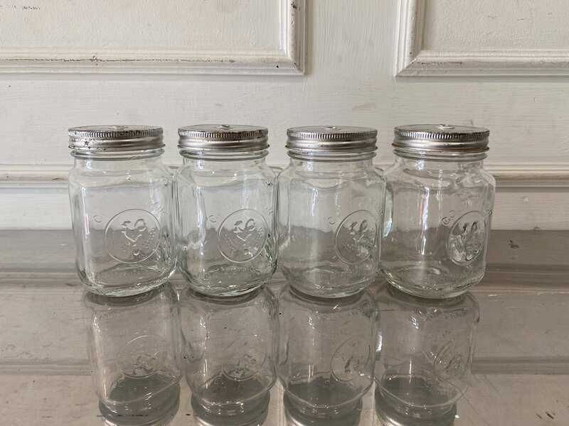 Set of clear glass Mason Jars with handles, embossed rooster design, Libbey brand.