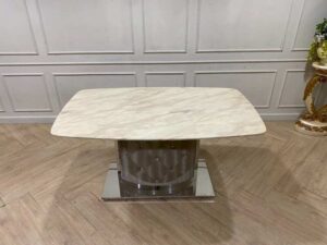 Dining table with stainless steel legs, leather upholstery, marble top