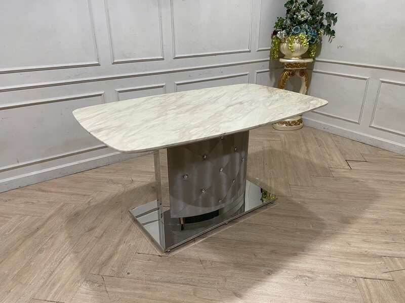Dining table with stainless steel legs, leather upholstery, marble top