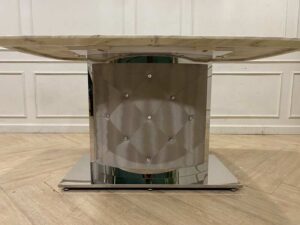 Dining table with stainless steel legs, leather upholstery, marble top