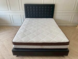 5-foot leather bed frame with button tufting, black color. Includes a 5-foot HLS DAISY mattress, 9 inches thick.