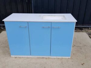 Blue washbasin with three doors