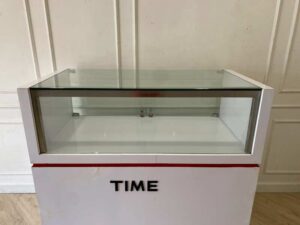 White glass display cabinet with red trim