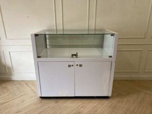 White glass display cabinet with red trim