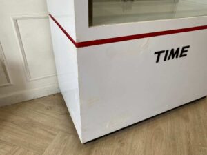 White glass display cabinet with red trim