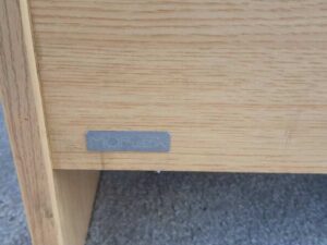 Brown wooden computer desk, MOFLEX brand.