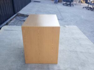 Brown wooden computer desk, MOFLEX brand.