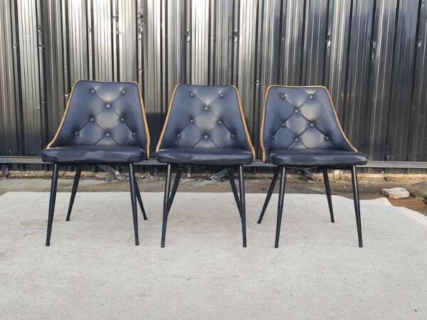 Dining chair, steel legs, black leather seat with button closure