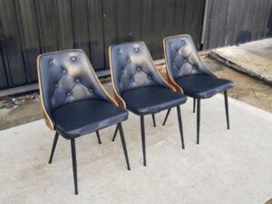 Dining chair, steel legs, black leather seat with button closure