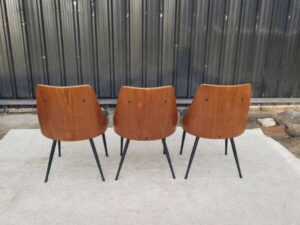 Dining chair, steel legs, black leather seat with button closure