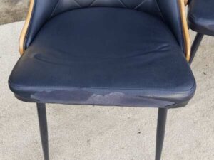 Dining chair, steel legs, black leather seat with button closure