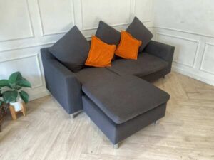 L-shaped corner sofa, 2 seats, fabric cushion, grey, with pillows
