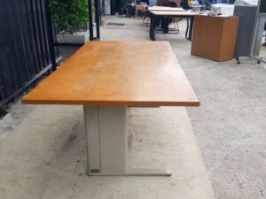 8-seat conference table with steel legs and brown wood top
