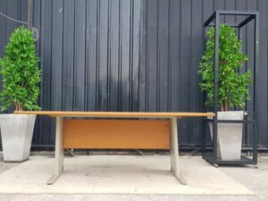 8-seat conference table with steel legs and brown wood top