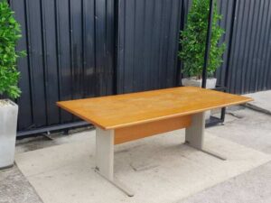 8-seat conference table with steel legs and brown wood top