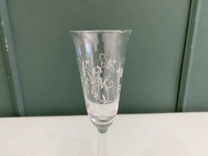 Fruit-shaped champagne glass with a vine pattern around the rim, from the Source Perrier Collection, Nesting model.