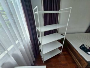 White metal shelving unit, IKEA JONAXEL model. (1)