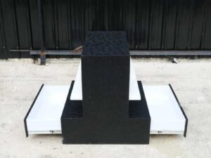 Wooden product shelf, 2 sides, 3 shelves on each side, 1 drawer, black wood frame with triangular pattern._52XAM9MFQT