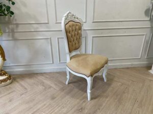 Single-seat Louis-style wooden chair with yellow button-tufted fabric upholstery.