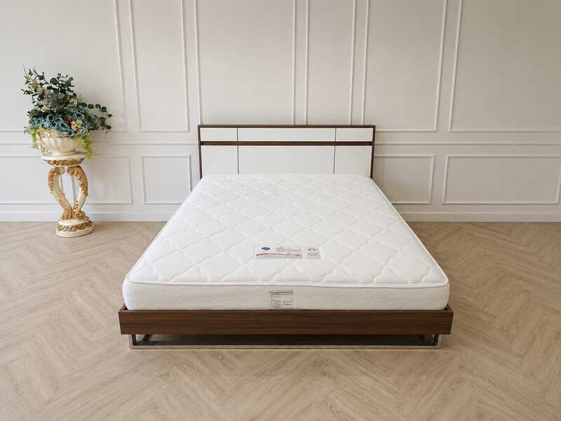 6-foot wooden bed frame with polished iron legs in a brown wood grain pattern, and a 6-foot white pocket spring mattress, Synda brand.