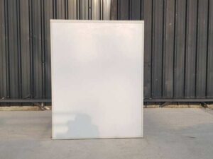 Moflex brand white 2-drawer filing cabinet with 1 storage compartment.