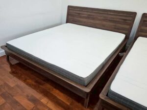 Brown solid wood bed (5-foot size) and white 5-foot mattress (IKEA Morgedal model)