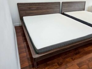 Brown solid wood bed (5-foot size) and white 5-foot mattress (IKEA Morgedal model)