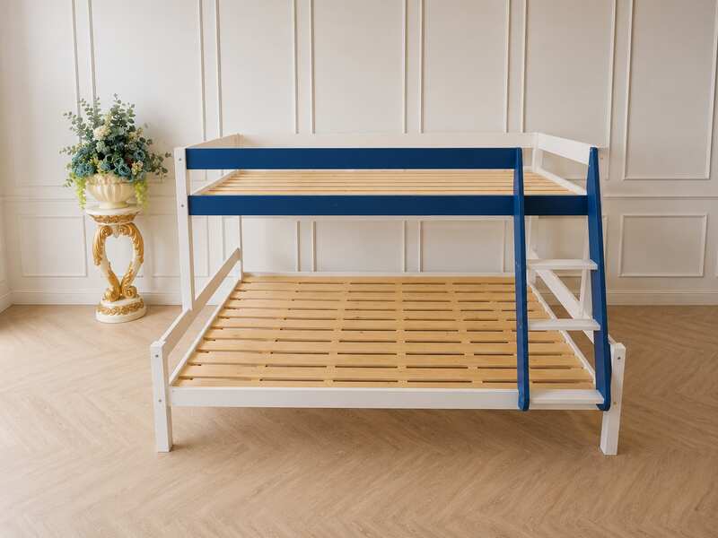 White and blue wooden bunk bed for children with shelves.