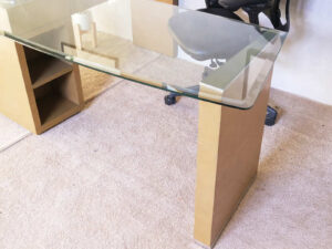 L-Shape corner work desk, glass top, foldable table. Has drawers and storage compartments._6IWKOCL622