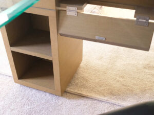 L-Shape corner work desk, glass top, foldable table. Has drawers and storage compartments._6IWKOCL622