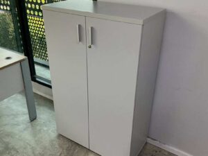 Tall filing cabinet with 2 doors, gray color.