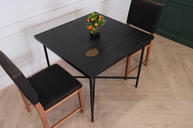 Table with black wood top, black steel legs, table top carved with gold stainless steel pattern._7MOYMHFGPW