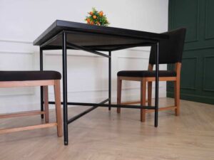 Table with black wood top, black steel legs, table top carved with gold stainless steel pattern._7MOYMHFGPW