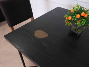 Table with black wood top, black steel legs, table top carved with gold stainless steel pattern._7MOYMHFGPW