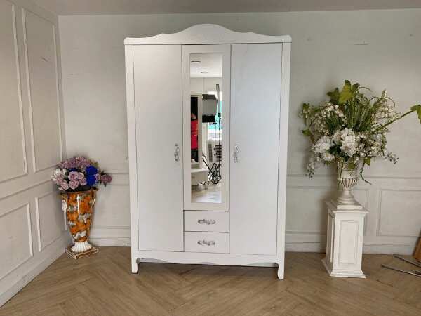White two-door wardrobe with two drawers, Koncept brand.