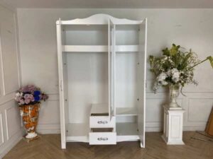White two-door wardrobe with two drawers, Koncept brand.