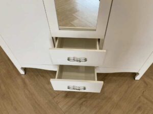 White two-door wardrobe with two drawers, Koncept brand.