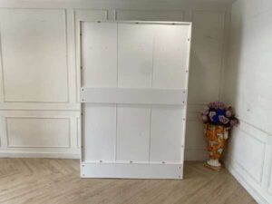White two-door wardrobe with two drawers, Koncept brand.