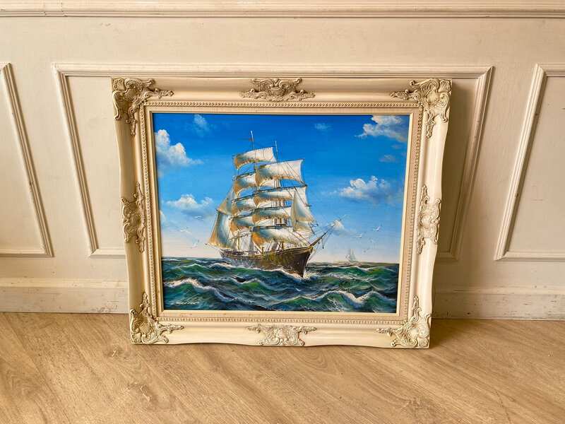 Oil painting of a pirate ship sailing in the ocean.
