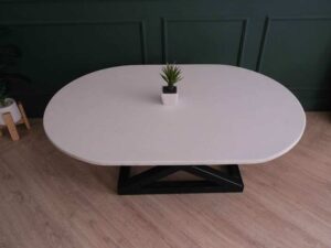 Central table, white wooden top, thick black steel frame, curved corners._88CU3KN5KJ